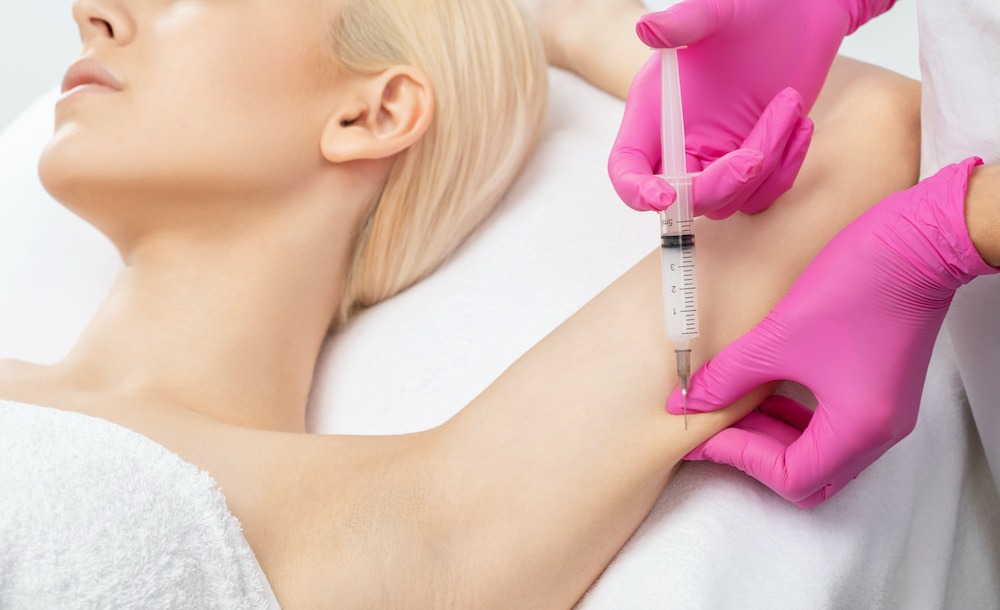 young woman receiving fat dissolving injection