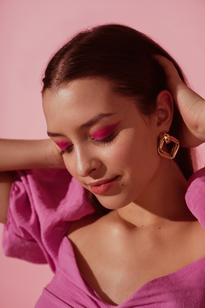 young woman wearing pink dress and pink eyeshadow