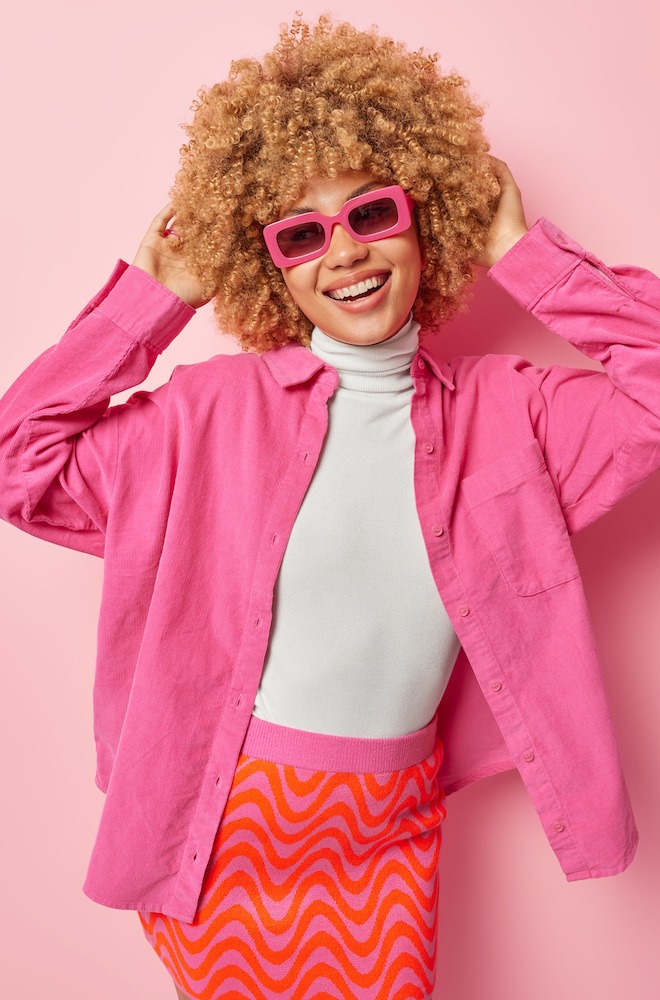 happy young woman wearing pink